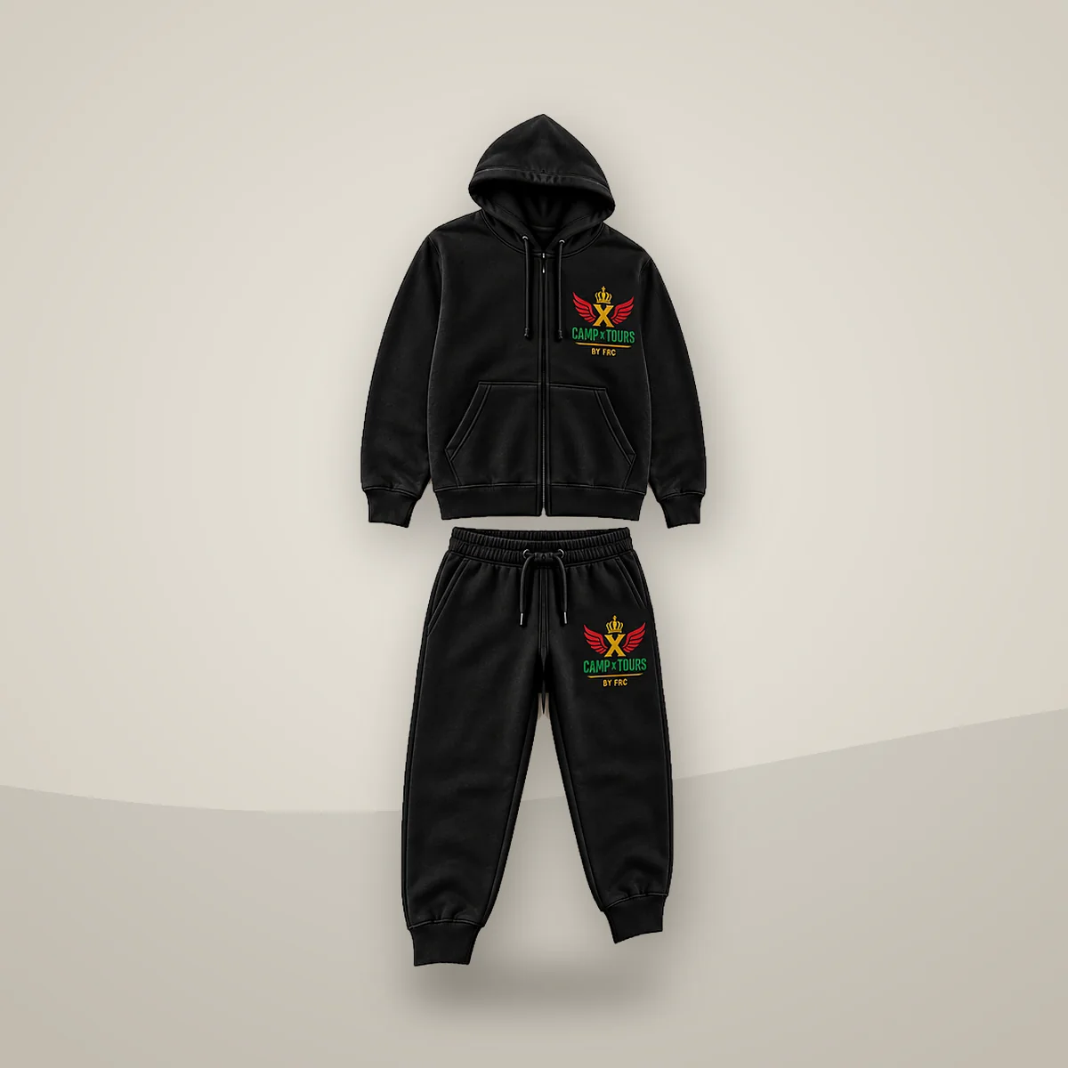 Camp X Tours by FRC Cotton Tracksuit, angled view showing the Camp X Tours by FRC emblem print