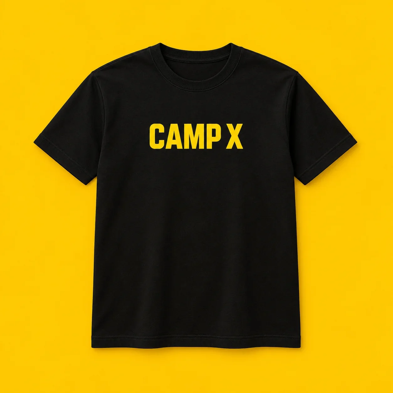 Black short-sleeve crewneck T-shirt with bold yellow CAMP X lettering across the chest, shown flat on a yellow background